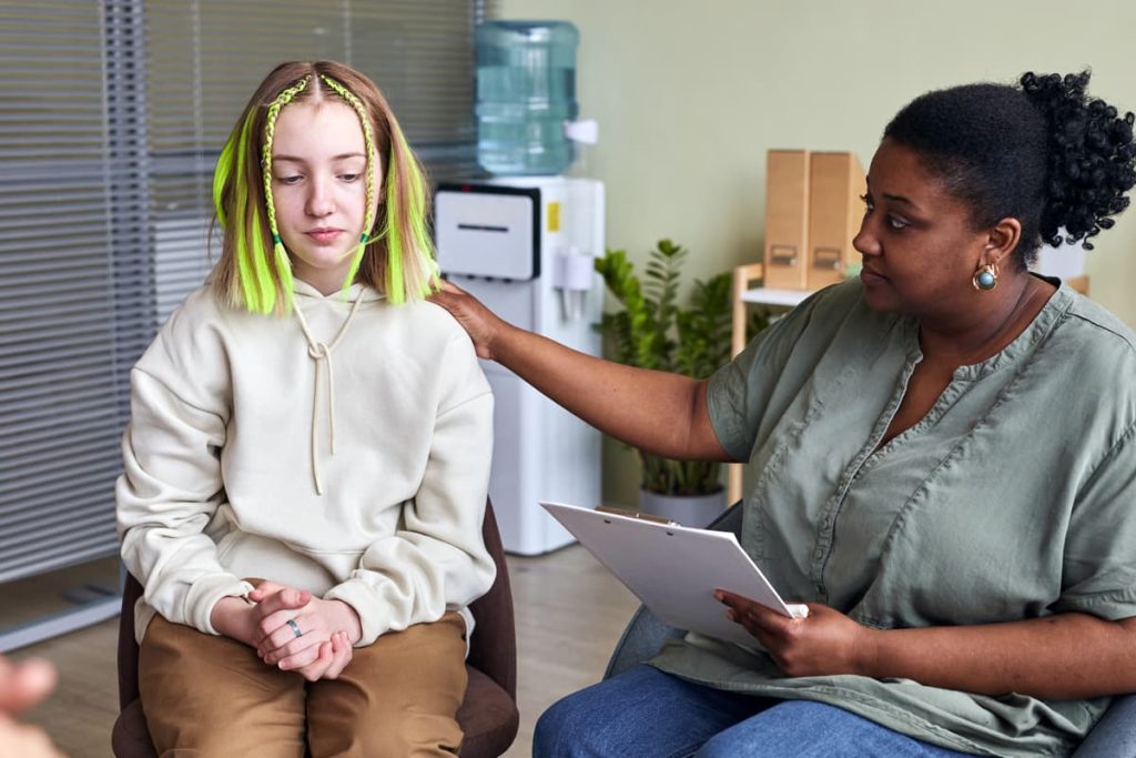 A student and counselor during a school based outpatient service appointment during school hours.
