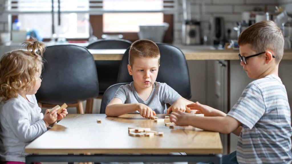 Autistic children playing a game together.