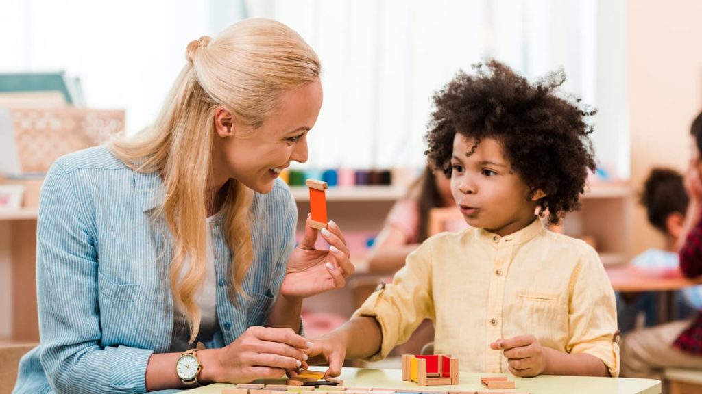 A certified specialist working with a child with autism.