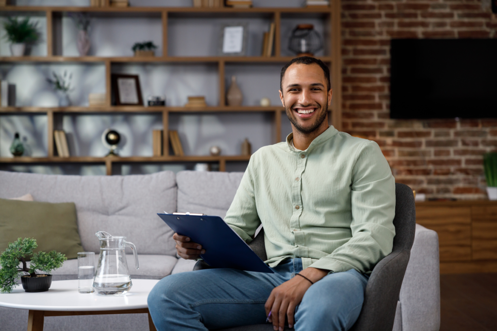 A family based therapist sitting with a clipboard at PCS.